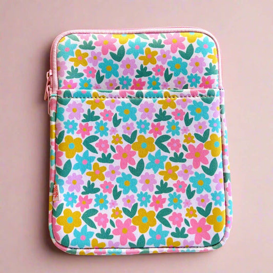 Floral patterned pouch on a pink background