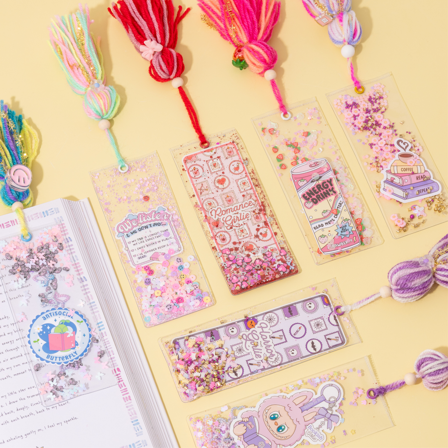 Colorful bookmarks and decorative ribbons on a yellow background