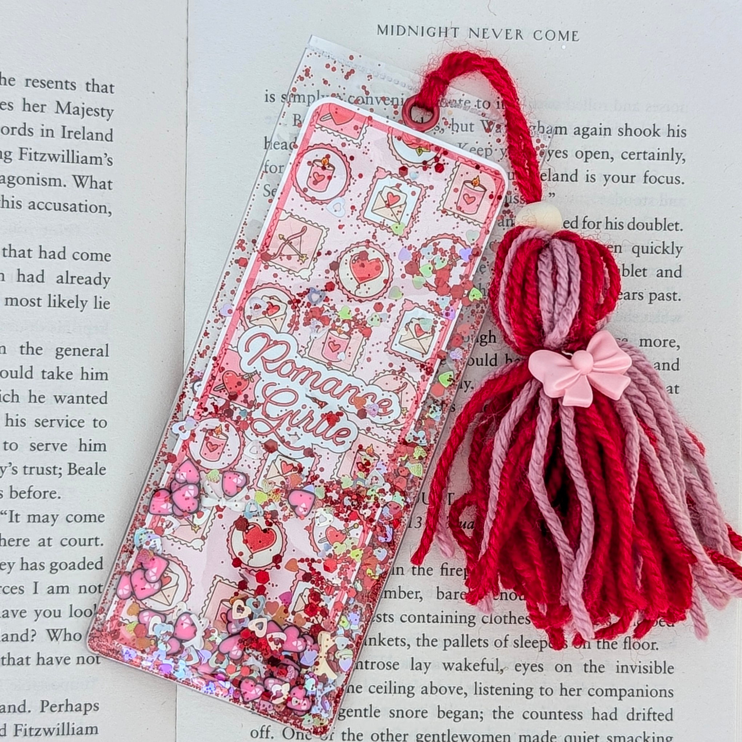 Decorative bookmark with tassels on a book page