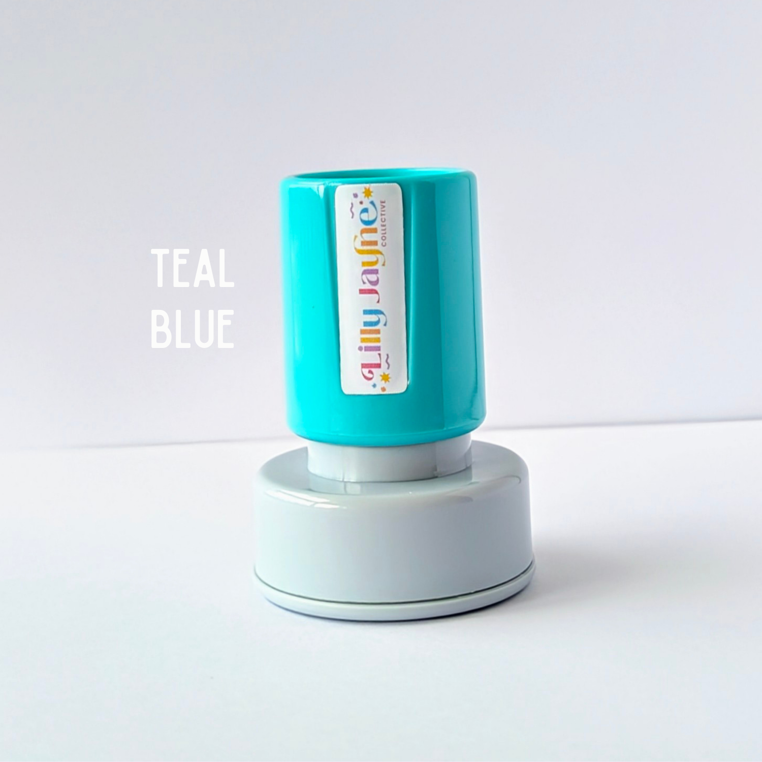 Teal blue stamp pad with a white background