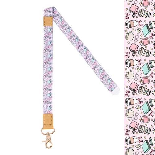 Fabric Lanyard with books, coffee, candles and bow images on it. Gold clasp.