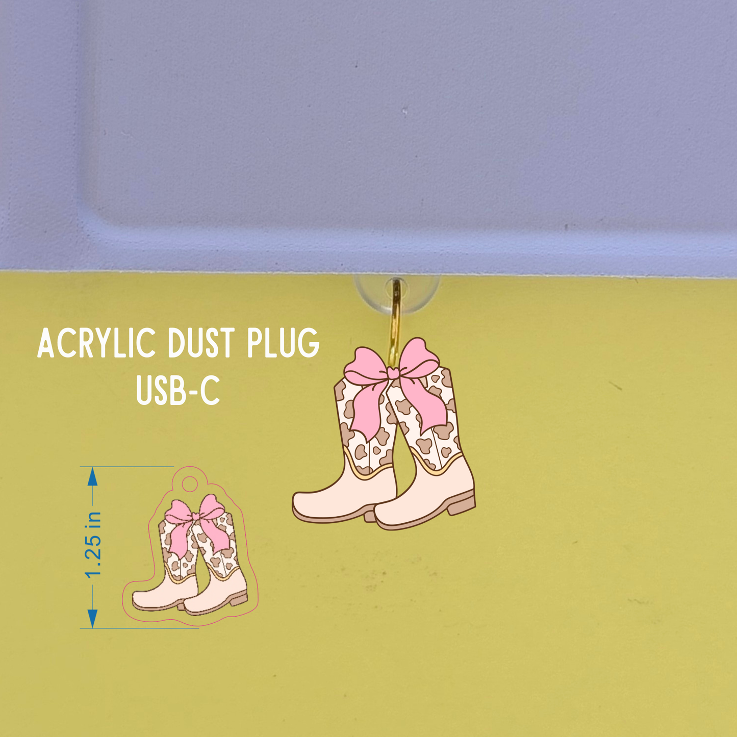 Acrylic dust plug shaped like cowboy boots with pink bows on a green background