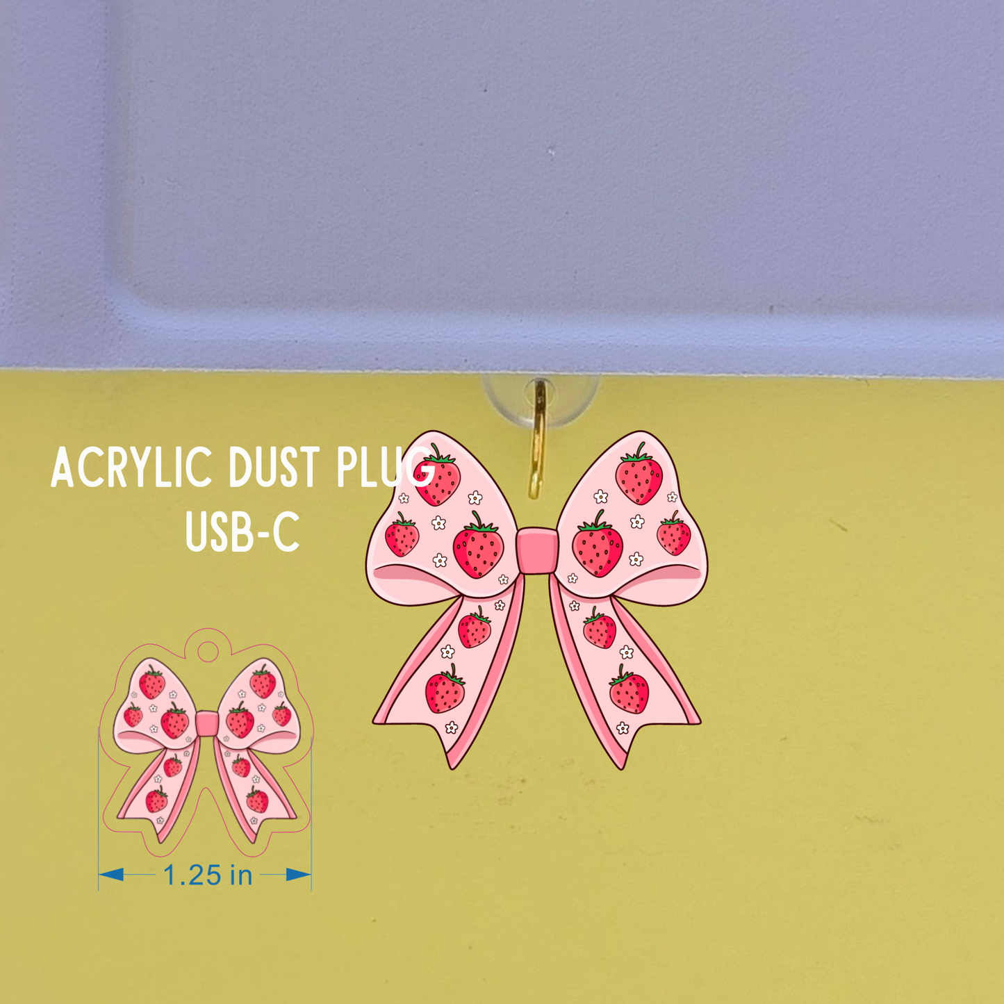 Acrylic dust plug with strawberry design on a green and purple background