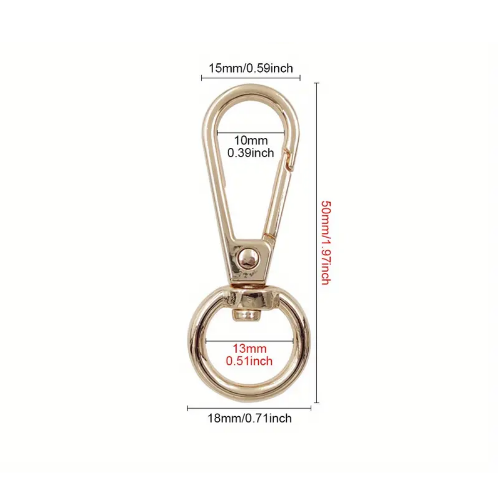 Gold metal keychain with dimensions labeled on a white background