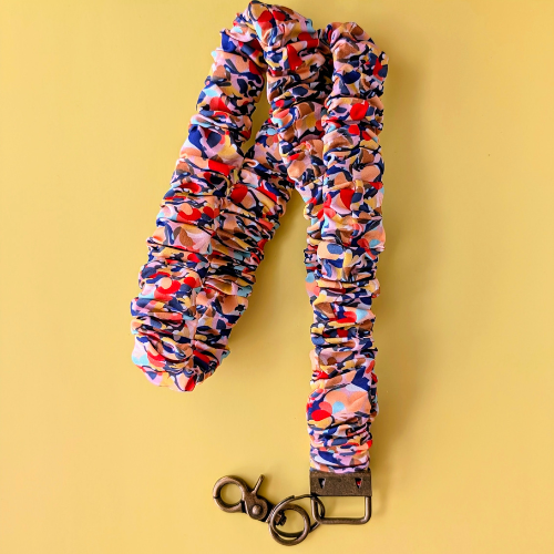 Colorful scrunchie with keychain on a yellow background