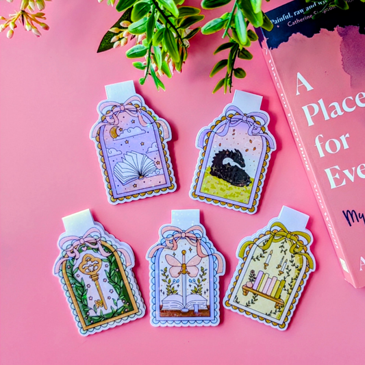 Decorative bookmarks with illustrations on a pink background