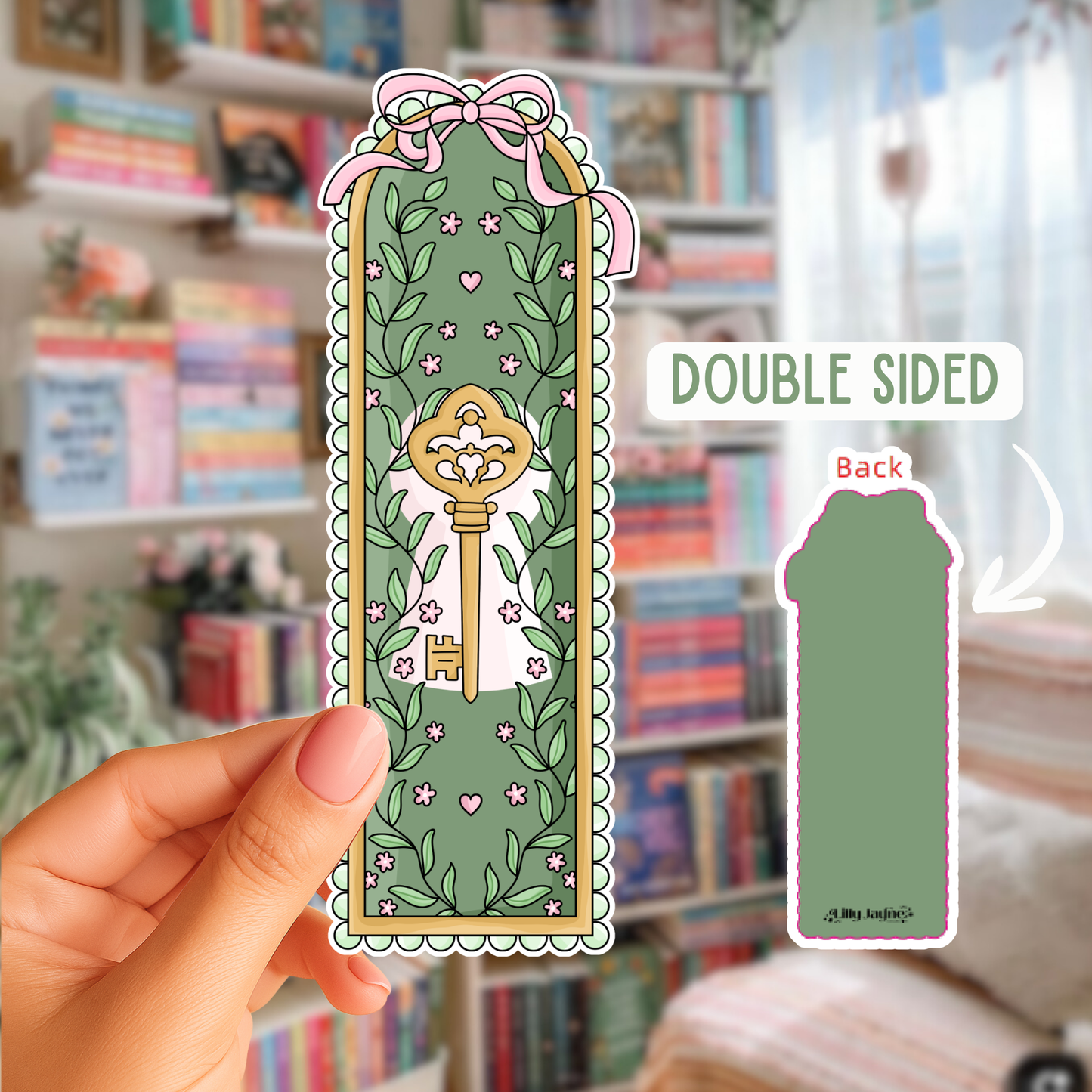 Decorative bookmark with key design held by a hand in front of a bookshelf.