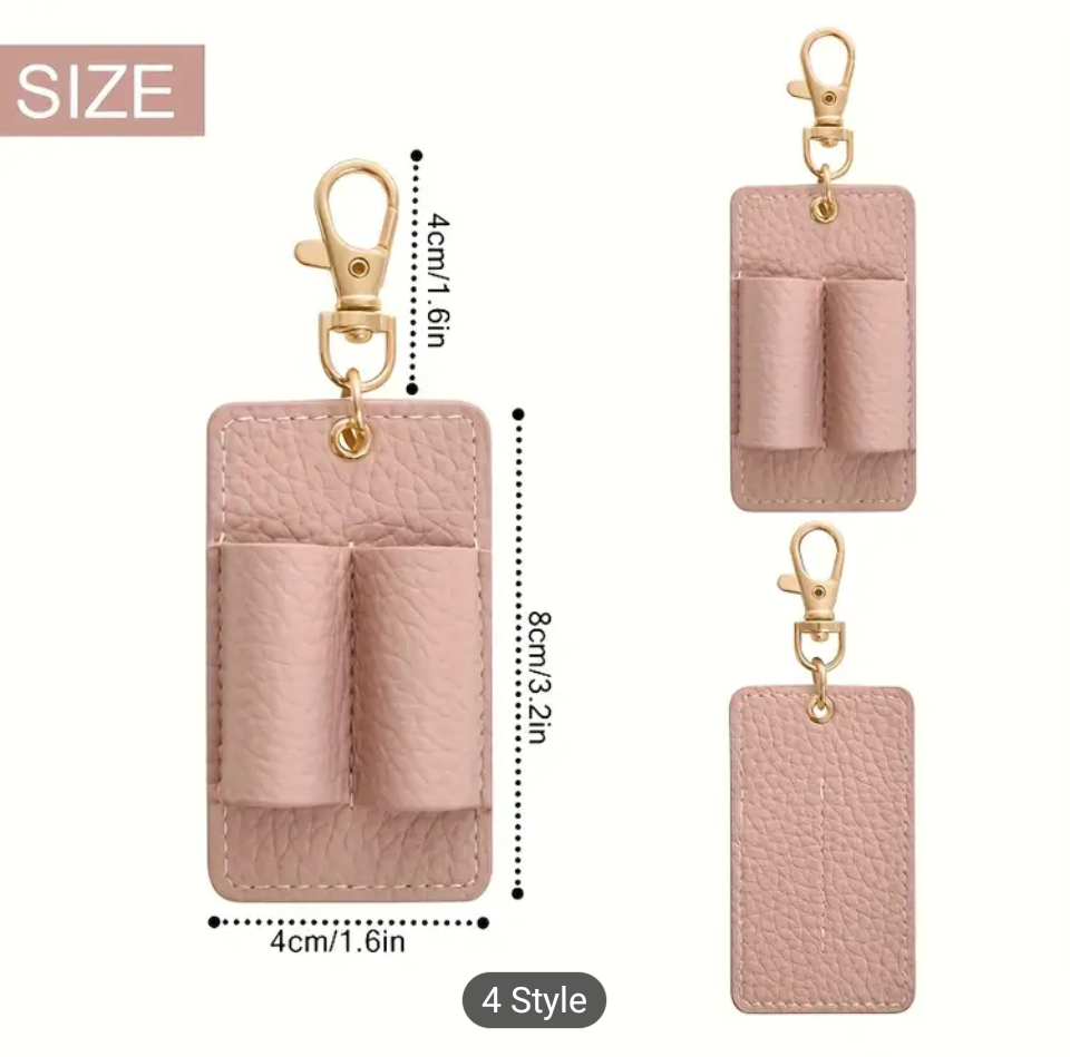 Pink leather keychain with dimensions and clip on a white background