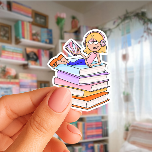 Hand holding a sticker of a cartoon girl on books with a blurred bookshelf background
