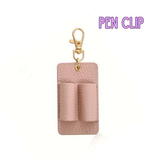 Pink pen clip with gold clasp on a white background