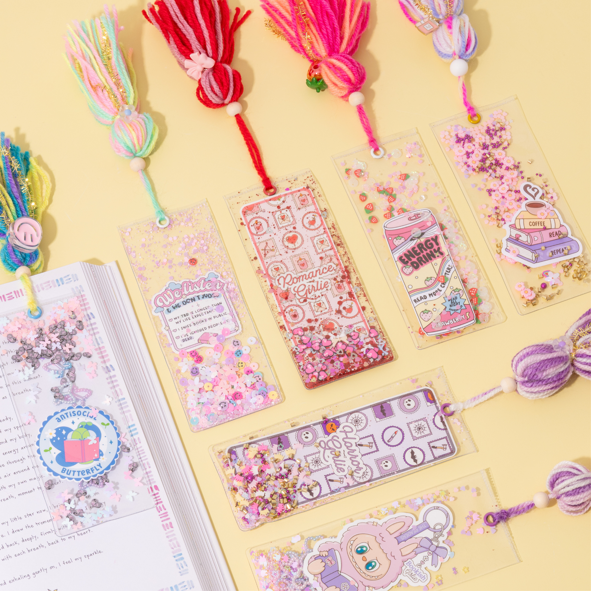 Colorful bookmarks and decorative ribbons on a yellow background
