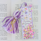 Decorative bookmark with tassel on a book page