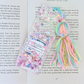 Colorful decorative bookmark with tassels on a book page