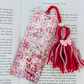 Decorative bookmark with tassels on a book page