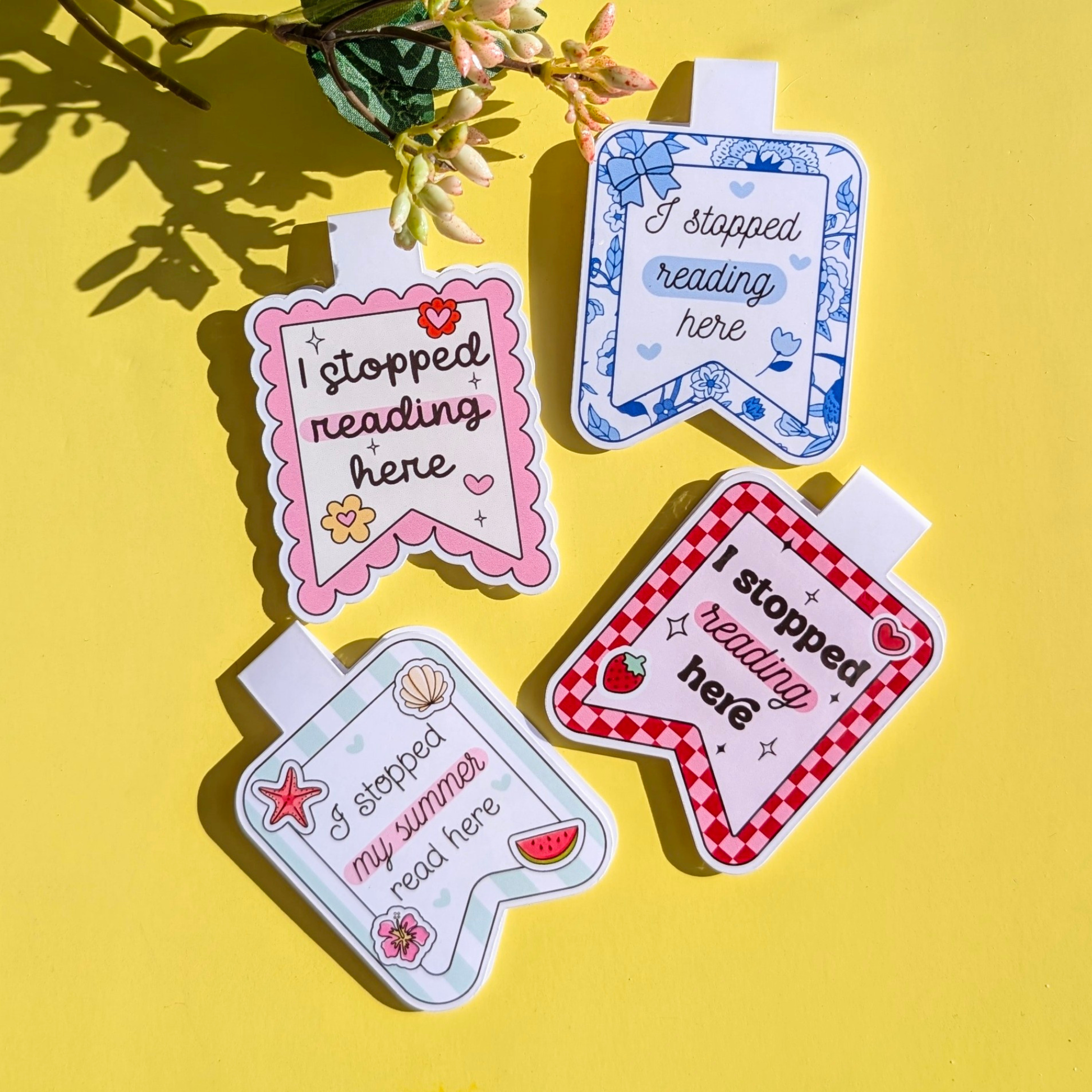 Four colorful bookmarks with 'I stopped reading here' text on a yellow background.