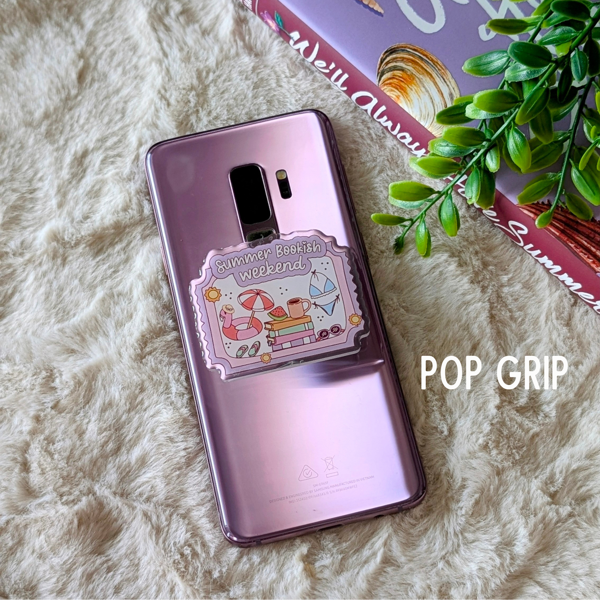 Phone case with a design on a fluffy surface with a plant