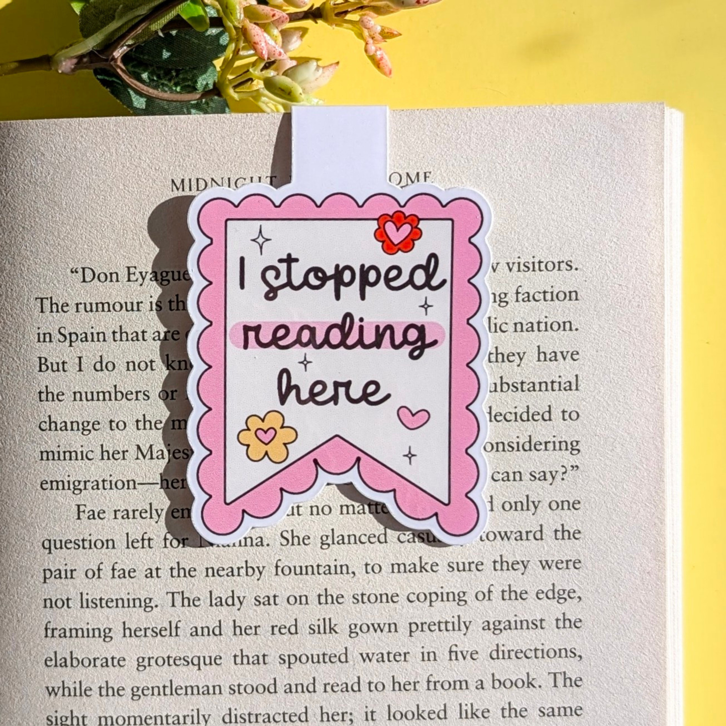 Bookmark with 'I stopped reading here' text on a book page