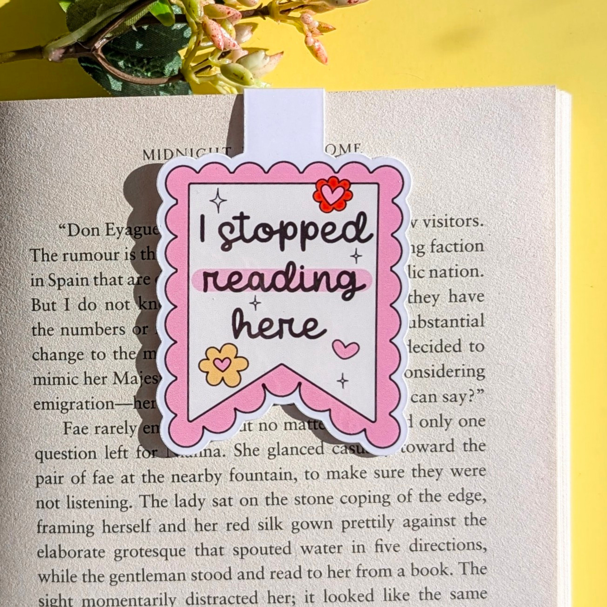 Bookmark with 'I stopped reading here' text on a book page