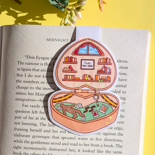 Decorative pop-up bookmark on an open book with a yellow background