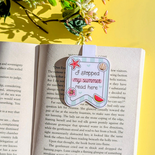 Book with a decorative bookmark on a yellow background