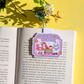 Open book with a 'Summer Bookish Weekend' sticker on a yellow background
