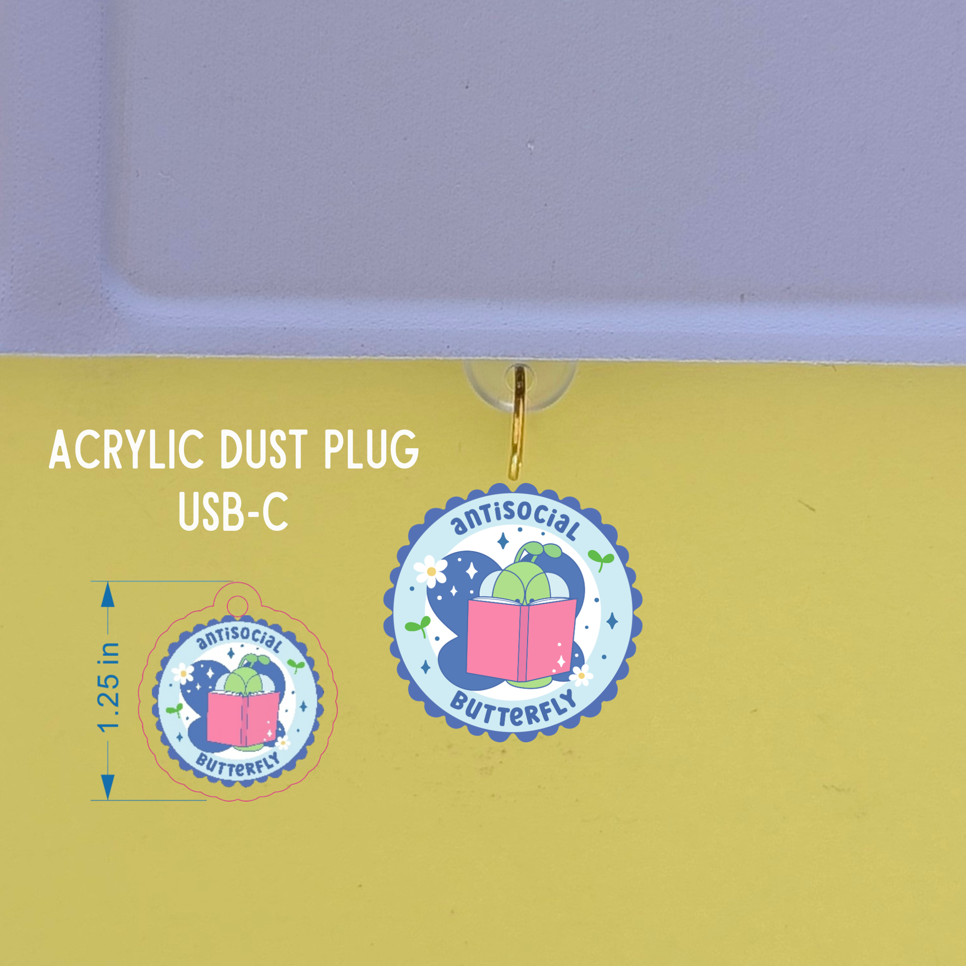 Acrylic dust plug with 'antisocial butterfly' design on a yellow background