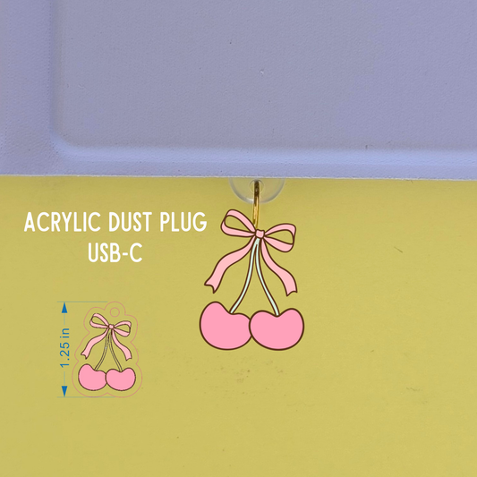 Acrylic dust plug with cherry design on a green background