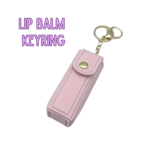 Pink lip balm keyring with gold accents on a white background
