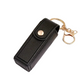 Black leather key case with gold keychain on a white background