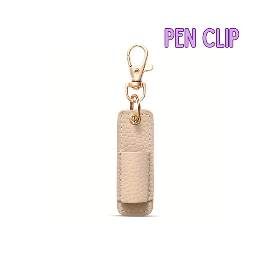 Beige pen clip with gold accent on a white background