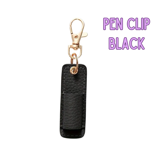 Black pen clip with gold clasp on a white background