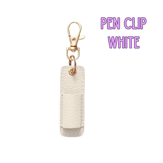 White pen clip with gold clasp on a white background