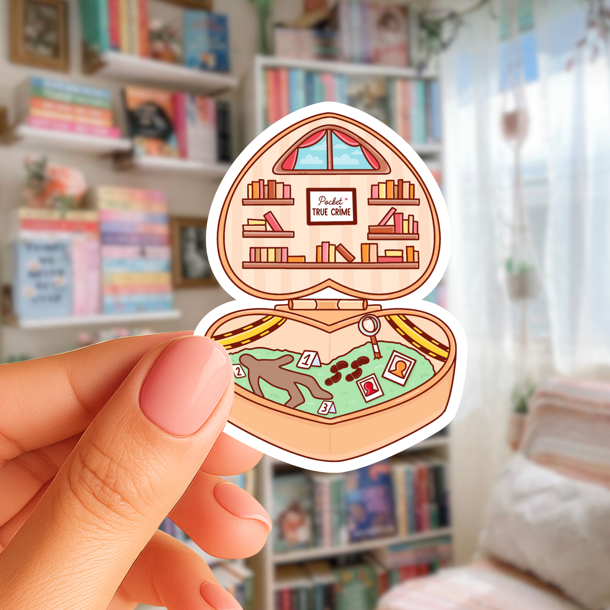 Sticker of a jewelry box with bookshelf design held by a hand in a room with bookshelves.