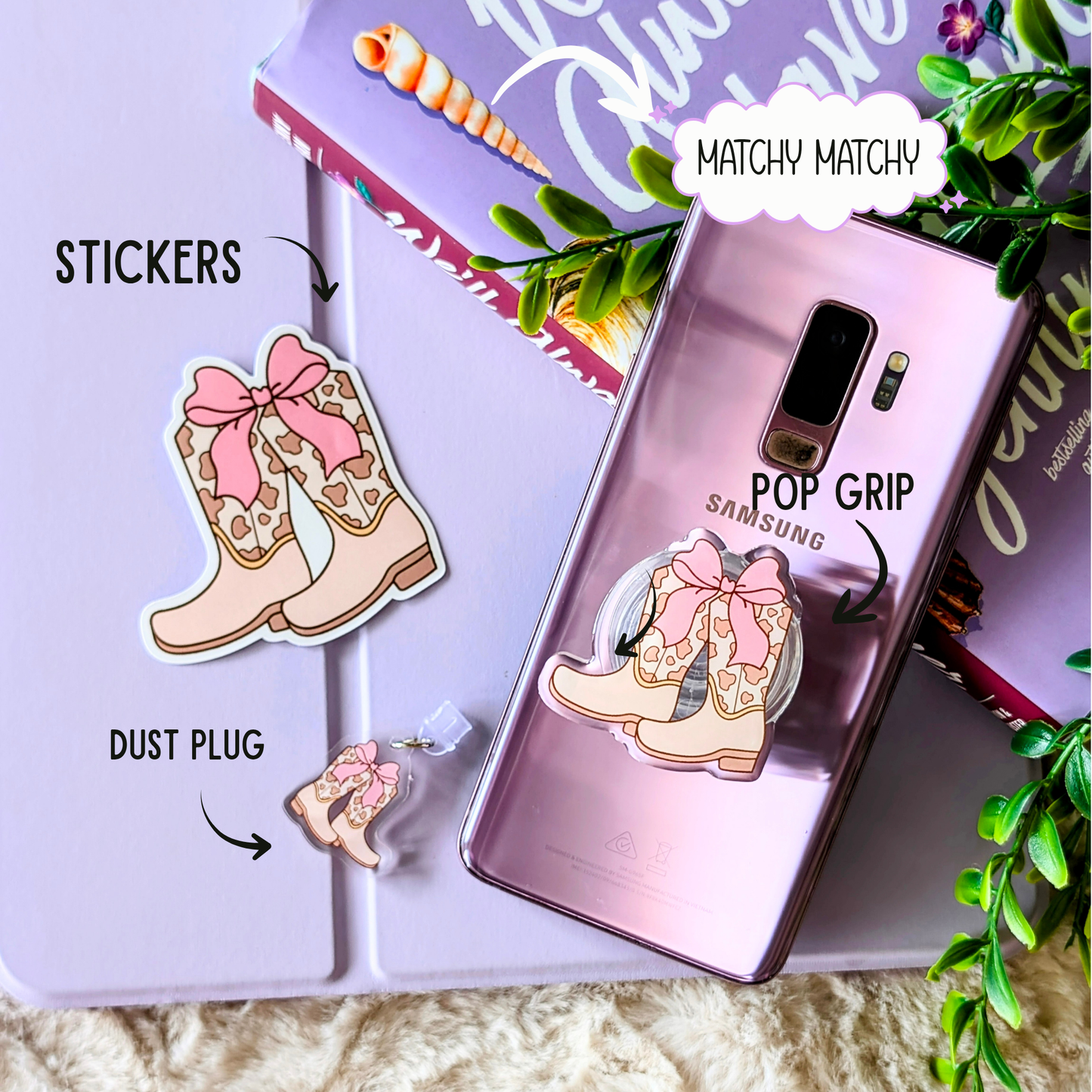 Samsung phone case with pink cowgirl boot design, stickers, and dust plug on a light purple background.