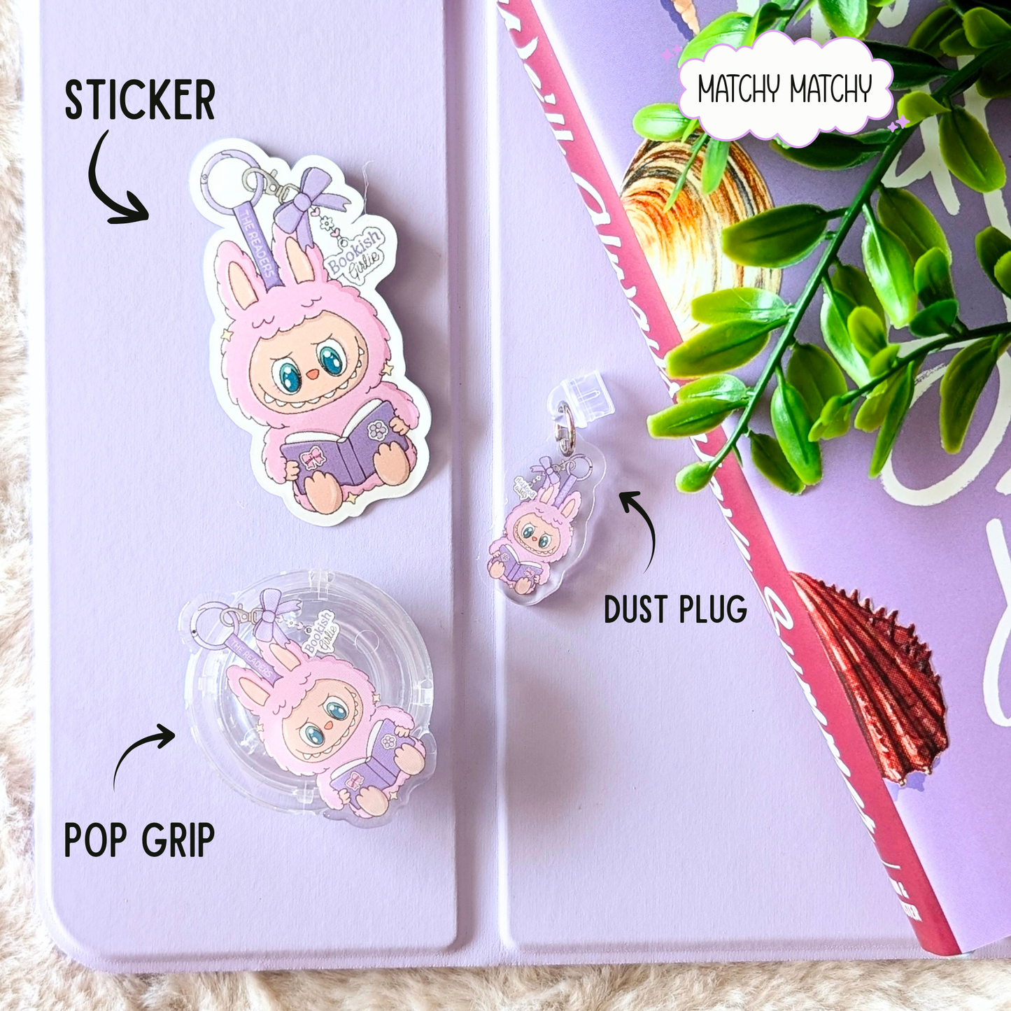 Pink and purple phone case with bunny design on a pink surface with text labels.