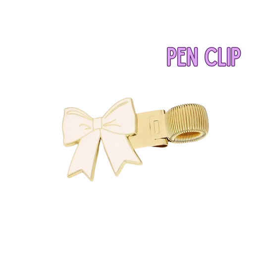 Gold pen clip with a white bow on a white background