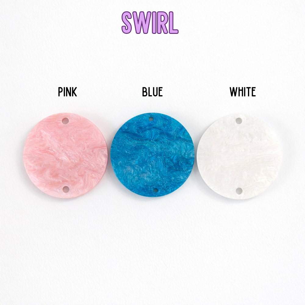 Three circular pendants in pink, blue, and white with 'Swirl' branding above them on a white background.