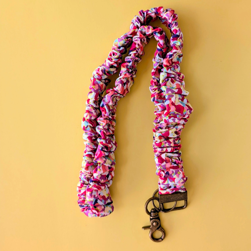 Multicolored scrunchie lanyard on a yellow background