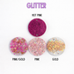 Four glittery round objects in different colors on a white background with 'GLITTER' text at the top.