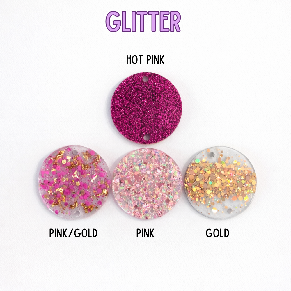 Four glittery round objects in different colors on a white background with 'GLITTER' text at the top.