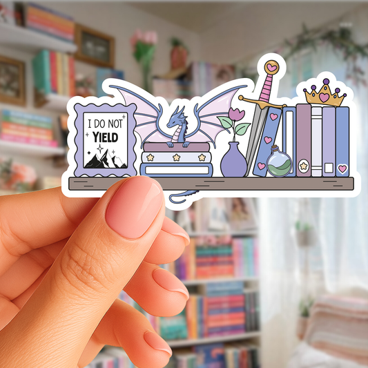 Sticker with dragon, books, and sword held by a hand in front of a bookshelf.