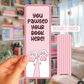 A hand holding a " You pawsed your book here!"  double sided bookmark