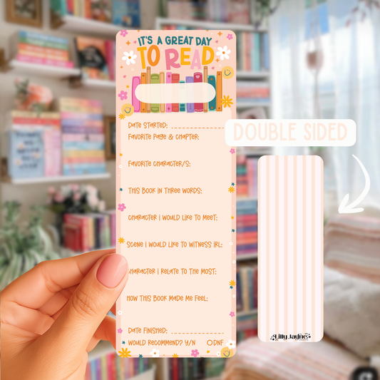 Colorful bookmark with reading log questions held by a hand in front of a bookshelf.