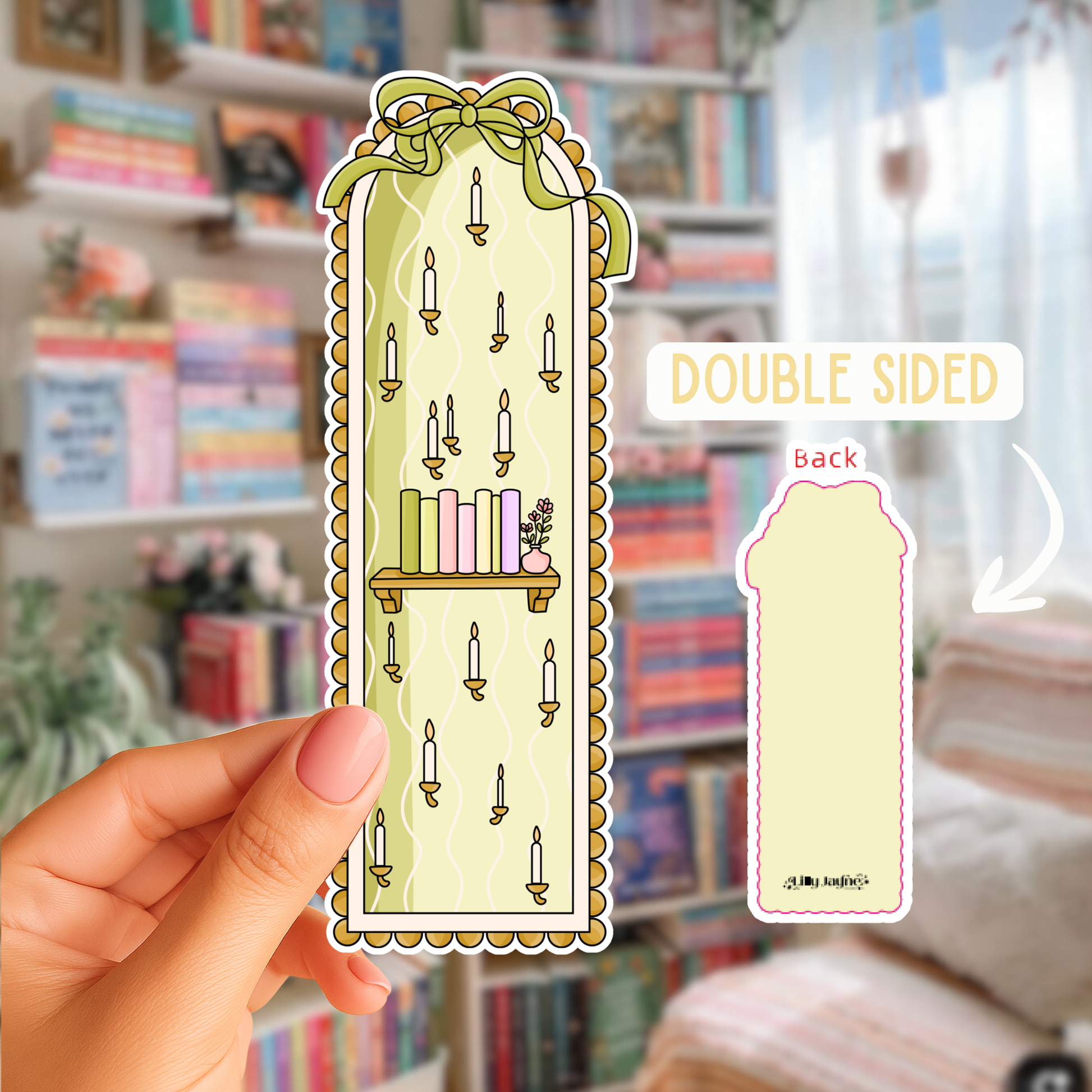 Double-sided decorative bookmark held in front of a bookshelf