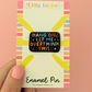 Enamel pin with 'Hang on, let me overthink this' text on a colorful card held by a hand.