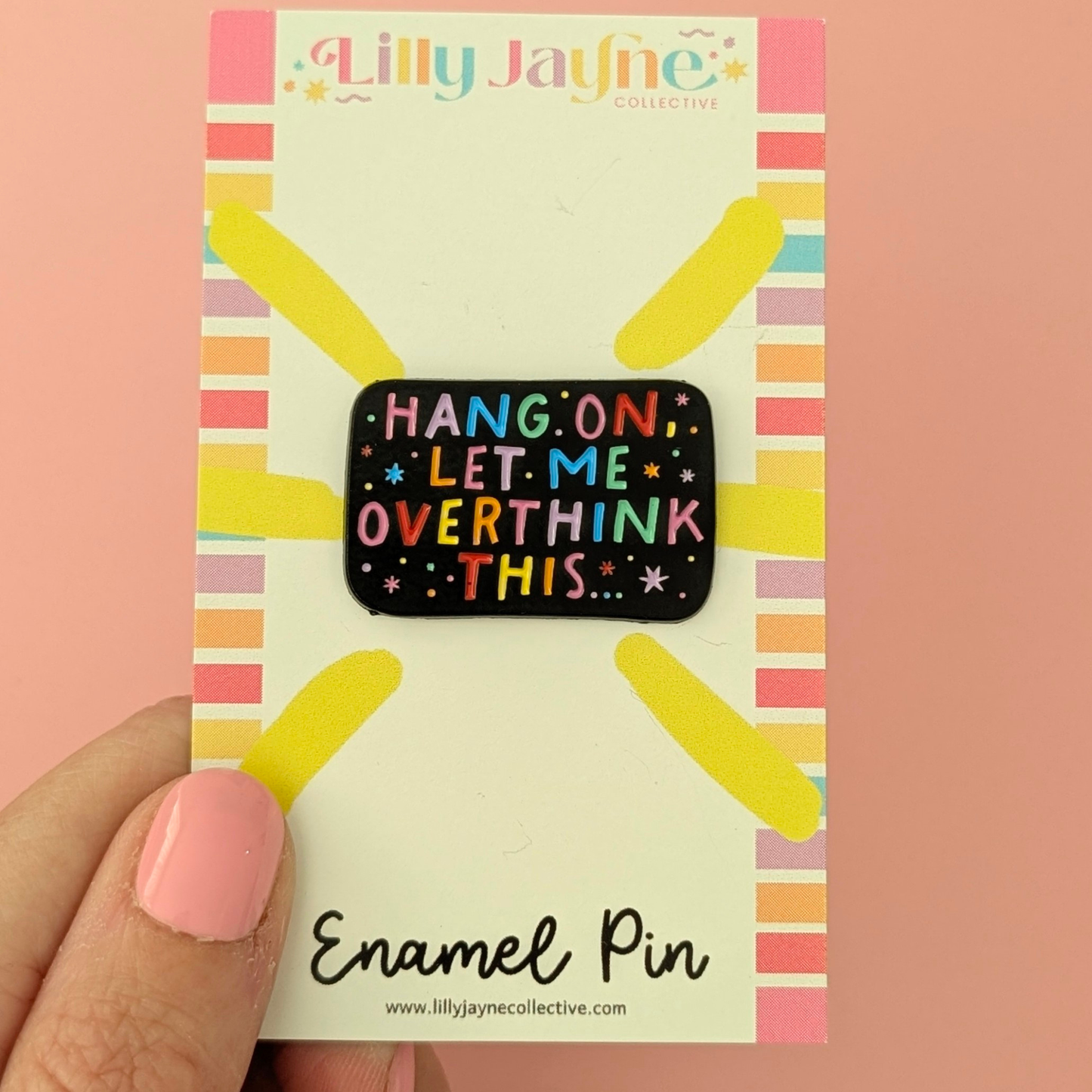 Enamel pin with 'Hang on, let me overthink this' text on a colorful card held by a hand.