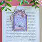 Decorative bookmark with a book design on a page with text