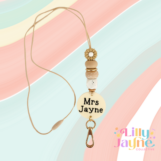 Beige daisy flower with beige coloured silicone beads and gold clasp