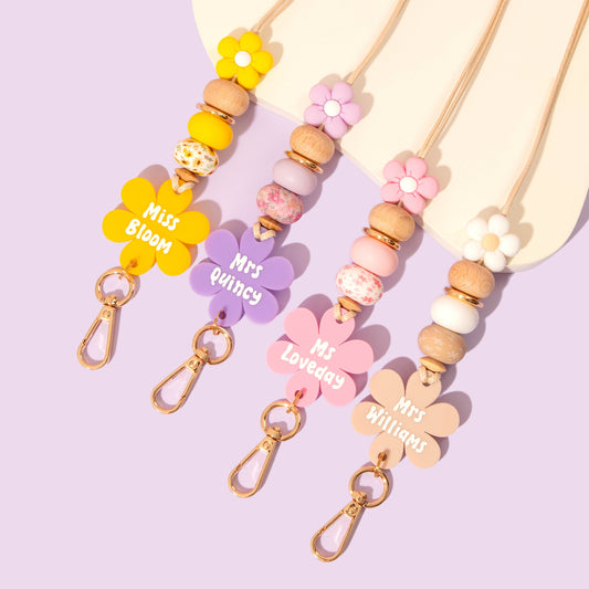 Collection of all 4 Flower personalised lanyards from the Blooms and Beads Collection. Yellow, Pink, purple and Beige options.