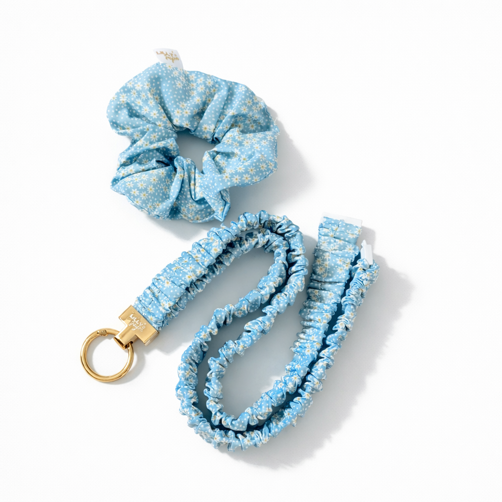 Set of blue floral scrunchie and scrunchie lanyard on a white background